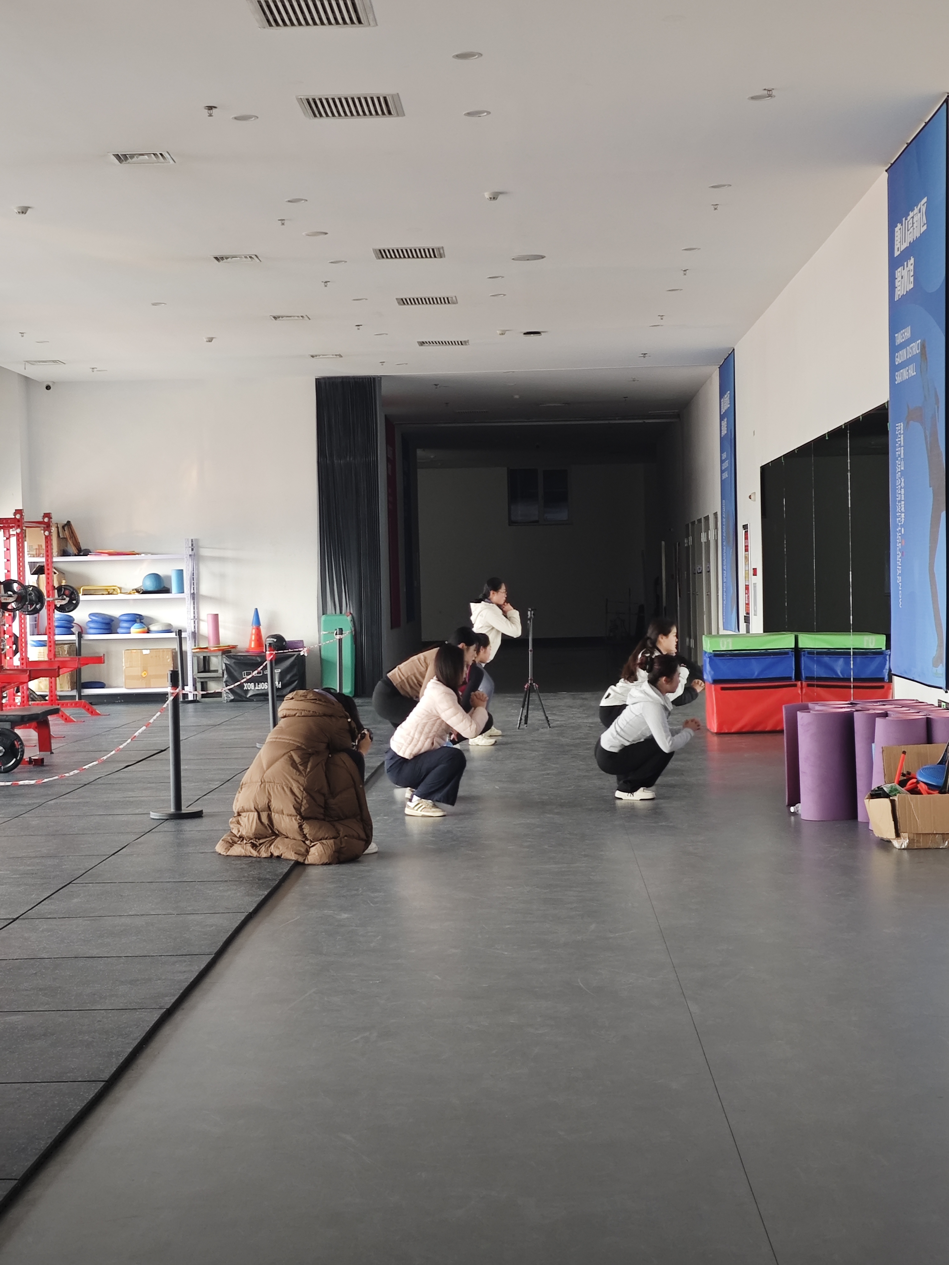 A group of adult learners practising movement together